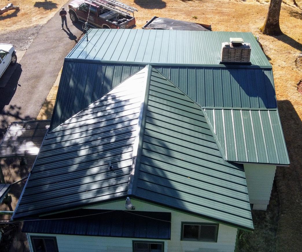 image of a metal green residential home roof